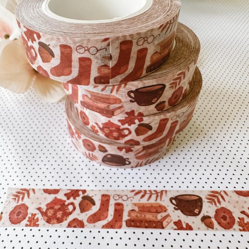 washi tape with images of teapots, books, glasses, acorns, and leaves.