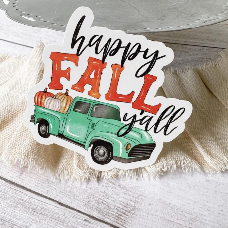 old time teal truck filled with pumpkin and the text "happy fall, y'all"